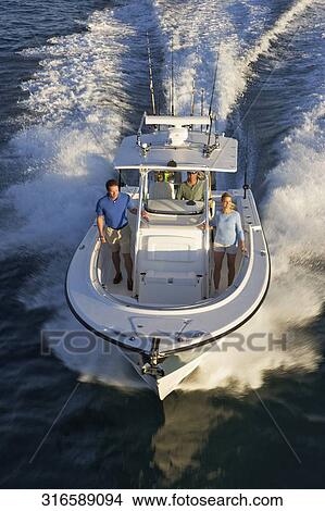 High angle view of tourists on a speedboat View Large Photo Image Picture - High angle view of tourists on a speedboat. Fotosearch