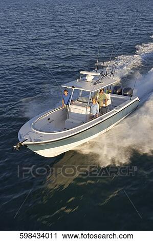 High angle view of tourists on a speedboat View Large Photo Image Stock Image - High angle view of tourists on a speedboat. Fotosearch