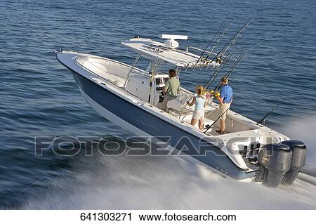 High angle view of tourists on a speedboat View Large Photo Image Stock Image - High angle view of tourists on a speedboat. Fotosearch