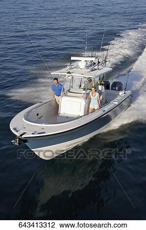 High angle view of tourists on a speedboat View Large Photo Image Stock Image - High angle view of tourists on a speedboat. Fotosearch