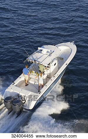 High angle view of tourists on a speedboat View Large Photo Image Stock Photography - High angle view of tourists on a speedboat. Fotosearch