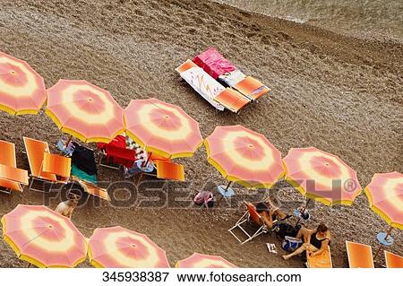 High angle view of tourists on the beach, Spiaggia Grande, Positano, Salerno, Amalfi Coast, Campania, Italy View Large Photo Image Stock Photo - High angle view of tourists on the beach, Spiaggia Grande, Positano, Salerno, Amalfi Coast, Campania, Italy. Fotosearch