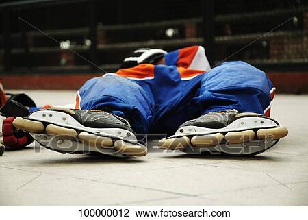 Ice hockey player lying down View Large Photo Image Stock Image - Ice hockey player lying down. Fotosearch