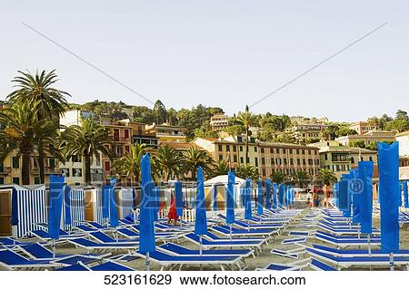 Lounge chairs on the beach, Italian Riviera, Santa Margherita Ligure, Genoa, Liguria, Italy View Large Photo Image Stock Photo - Lounge chairs on the beach, Italian Riviera, Santa Margherita Ligure, Genoa, Liguria, Italy. Fotosearch