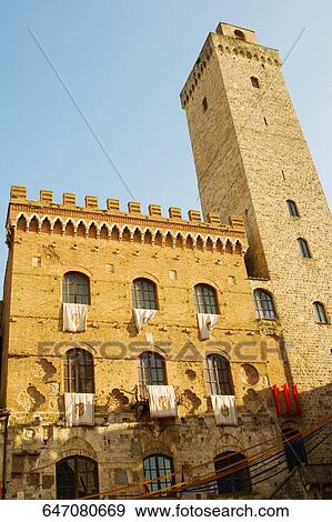 Low angle view of a building, Palazzo Del Podesta, La Rognosa, San Gimignano, Siena Province, Tuscany, Italy View Large Photo Image Stock Photo - Low angle view of a building, Palazzo Del Podesta, La Rognosa, San Gimignano, Siena Province, Tuscany, Italy. Fotosearch