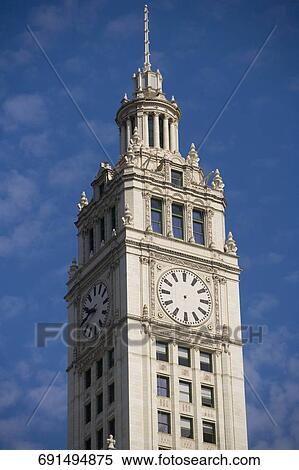 Low angle view of a clock tower, Wrigley Building, Chicago, Illinois View Large Photo Image Stock Photography - Low angle view of a clock tower, Wrigley Building, Chicago, Illinois. Fotosearch