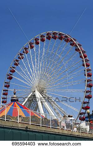 Low angle view of a ferris wheel in an amusement park, Navy Pier Park, Navy Pier, Chicago, Illinois, USA View Large Photo Image Stock Image - Low angle view of a ferris wheel in an amusement park, Navy Pier Park, Navy Pier, Chicago, Illinois, USA. Fotosearch