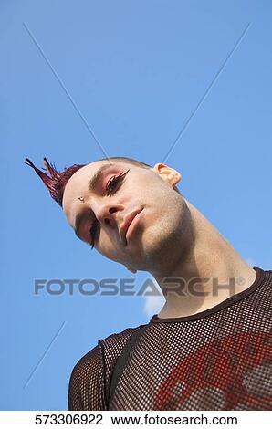 Low angle view of a gay man View Large Photo Image Stock Image - Low angle view of a gay man. Fotosearch
