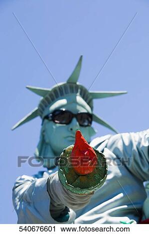 Low angle view of a mid adult man dresses as the Statue of Liberty, New York City, New York State, USA View Large Photo Image Stock Image - Low angle view of a mid adult man dresses as the Statue of Liberty, New York City, New York State, USA. Fotosearch