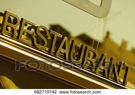 Stock Image - Low angle view of a restaurant sign, Le Mans, Sarthe, Pays-de-la-Loire, France. Fotosearch