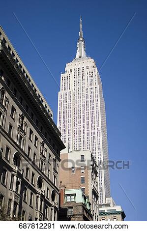 Low angle view of a skyscraper, Empire State Building, Manhattan, New York City, New York State, USA View Large Photo Image Stock Image - Low angle view of a skyscraper, Empire State Building, Manhattan, New York City, New York State, USA. Fotosearch