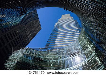 Low angle view of a skyscraper in a city, Manhattan, New York City, New York State, USA View Large Photo Image Stock Image - Low angle view of a skyscraper in a city, Manhattan, New York City, New York State, USA. Fotosearch