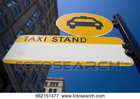 Low angle view of a taxi stand board, Chicago, Illinois, USA View Large Photo Image Stock Photo - Low angle view of a taxi stand board, Chicago, Illinois, USA. Fotosearch