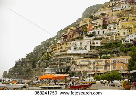 Stock Image - Low angle view of a town on a hill, Spiaggia Grande, Positano, Amalfi Coast, Salerno, Campania, Italy. Fotosearch