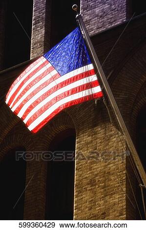 Low angle view of an American flag, New York City, New York State, USA View Large Photo Image Stock Photo - Low angle view of an American flag, New York City, New York State, USA. Fotosearch
