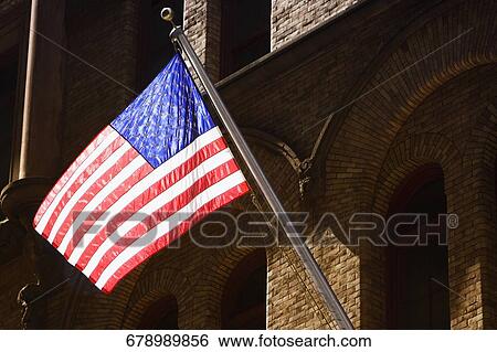 Low angle view of an American flag, New York City, New York State, USA View Large Photo Image Stock Photograph - Low angle view of an American flag, New York City, New York State, USA. Fotosearch