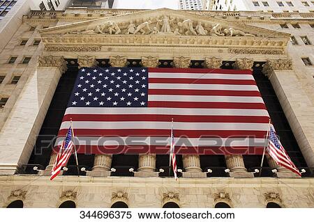 Low angle view of an American flag on a financial building, Wall Street, Manhattan, New York City, New York State, USA View Large Photo Image Stock Photography - Low angle view of an American flag on a financial building, Wall Street, Manhattan, New York City, New York State, USA. Fotosearch
