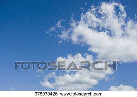Low angle view of clouds in the sky View Large Photo Image Stock Photograph - Low angle view of clouds in the sky. Fotosearch