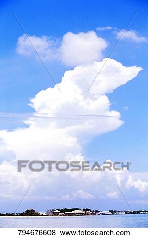 Low angle view of clouds over a sea View Large Photo Image Stock Photo - Low angle view of clouds over a sea. Fotosearch