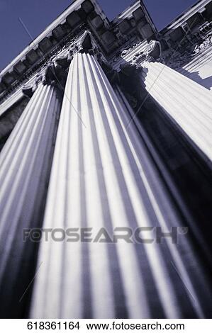 Low angle view of columns of a building View Large Photo Image Picture - Low angle view of columns of a building. Fotosearch