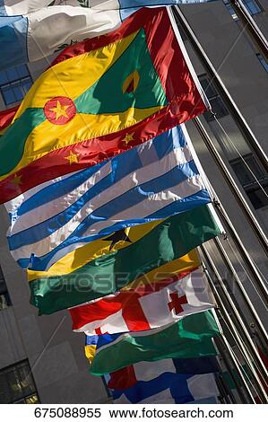 Low angle view of flags fluttering in a row, New York City, New York State, USA View Large Photo Image Stock Photography - Low angle view of flags fluttering in a row, New York City, New York State, USA. Fotosearch