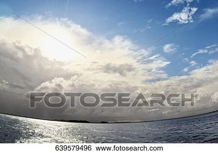 Stock Photograph - Low angle view of moon over the sea, Florida Keys, Florida, USA. Fotosearch