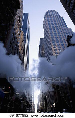 Low angle view of smoke in a street, 43rd Street, Bryant Park, New York City, New York State, USA View Large Photo Image Stock Image - Low angle view of smoke in a street, 43rd Street, Bryant Park, New York City, New York State, USA. Fotosearch