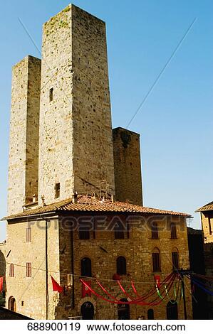 Low angle view of towers, Torri di San Gimignano, San Gimignano, Siena Province, Tuscany, Italy View Large Photo Image Stock Photo - Low angle view of towers, Torri di San Gimignano, San Gimignano, Siena Province, Tuscany, Italy. Fotosearch