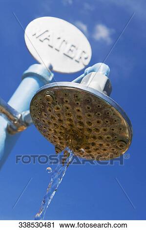 Low angle view of water dripping from a beach shower, Miami Beach, Florida, USA View Large Photo Image Stock Image - Low angle view of water dripping from a beach shower, Miami Beach, Florida, USA. Fotosearch