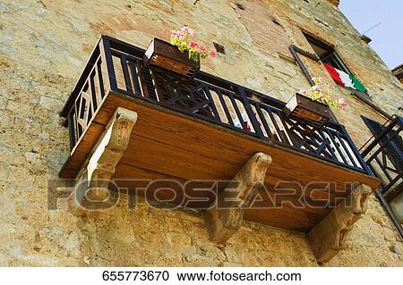 Low angle view of window boxes at a balcony, San Gimignano, Siena Province, Tuscany, Italy View Large Photo Image Stock Image - Low angle view of window boxes at a balcony, San Gimignano, Siena Province, Tuscany, Italy. Fotosearch