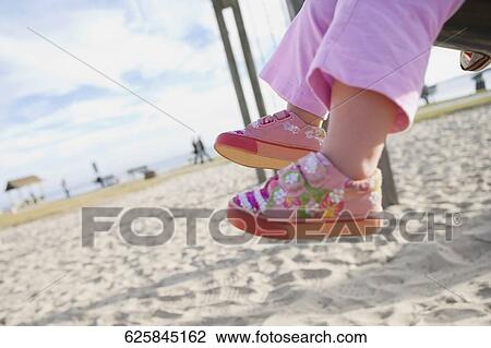 Low section view of a baby's legs View Large Photo Image Stock Image - Low section view of a baby's legs. Fotosearch