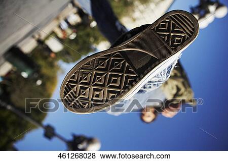 Stock Photo - Low section view of the sole of a person's shoe. Fotosearch