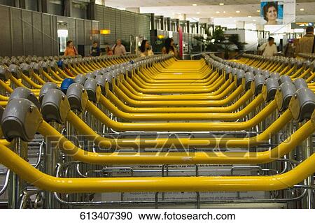 Stock Image - Luggage cart on an airport, Charles de Gaulle International Airport, Paris, Ile-de-France, France. Fotosearch