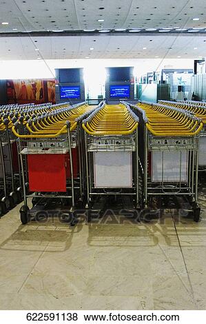 Stock Photo - Luggage cart on an airport, Charles de Gaulle International Airport, Paris, Ile-de-France, France. Fotosearch