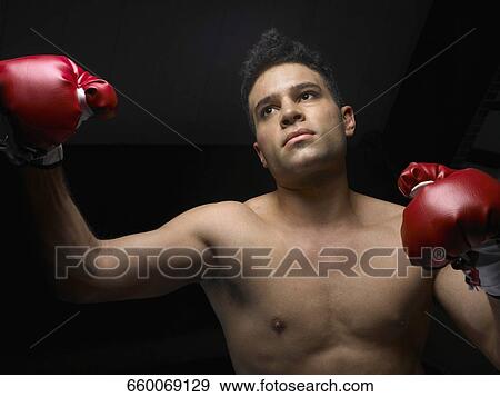 Stock Photo - Male boxer wearing boxing gloves. Fotosearch