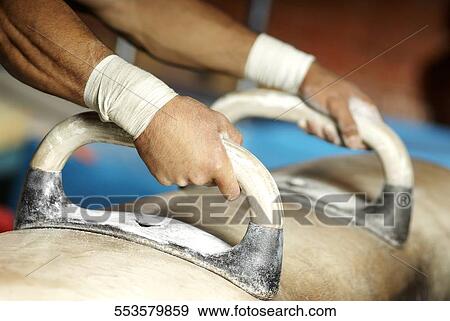 Male gymnast practicing on a balance beam View Large Photo Image Stock Photo - Male gymnast practicing on a balance beam. Fotosearch