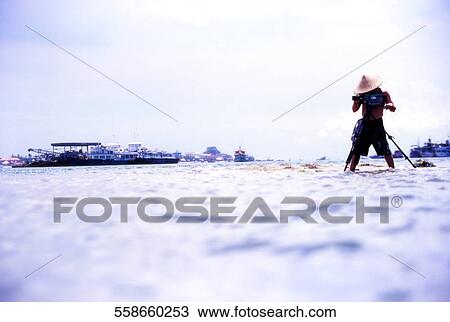 Man standing in snow and filming View Large Photo Image Stock Image - Man standing in snow and filming. Fotosearch