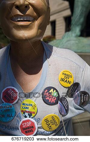Man wearing a mask and protesting with badges on his t-shirt, Chicago, Illinois, USA View Large Photo Image Stock Image - Man wearing a mask and protesting with badges on his t-shirt, Chicago, Illinois, USA. Fotosearch