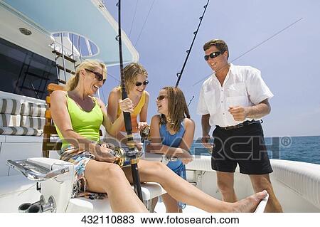 Mature couple fishing with their children View Large Photo Image Stock Image - Mature couple fishing with their children. Fotosearch
