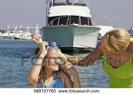 Mature woman with her daughter at the seaside View Large Photo Image Stock Image - Mature woman with her daughter at the seaside. Fotosearch
