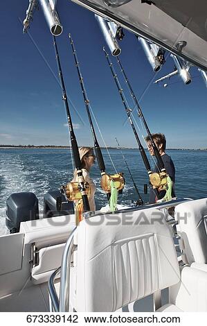 Mid adult couple on a speedboat View Large Photo Image Stock Image - Mid adult couple on a speedboat. Fotosearch