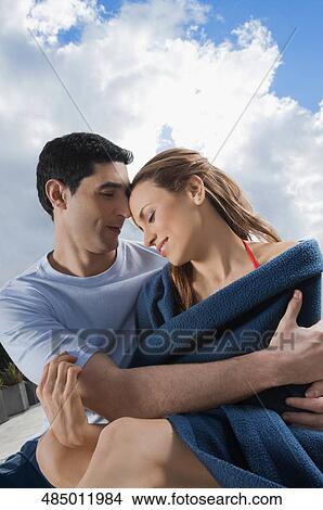 Picture - Mid adult couple romancing. Fotosearch