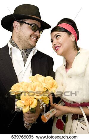 Mid adult man and a young woman looking at each other View Large Photo Image Stock Photography - Mid adult man and a young woman looking at each other. Fotosearch