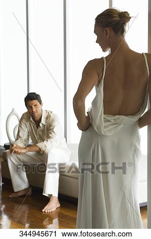 Mid adult man looking at a mid adult woman View Large Photo Image Stock Image - Mid adult man looking at a mid adult woman. Fotosearch