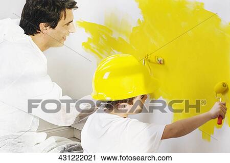 Mid adult man with his son painting a wall View Large Photo Image Stock Image - Mid adult man with his son painting a wall. Fotosearch