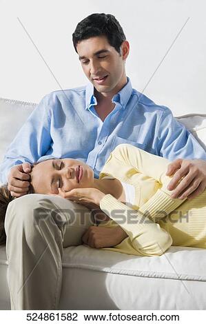 Mid adult woman sleeping on a mid adult man's lap View Large Photo Image Stock Image - Mid adult woman sleeping on a mid adult man's lap. Fotosearch
