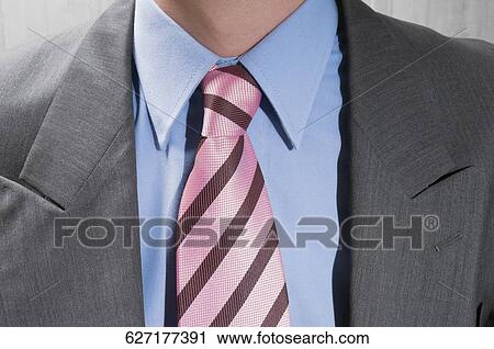 Mid section view of a businessman View Large Photo Image Stock Image - Mid section view of a businessman. Fotosearch