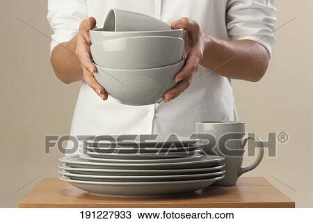 Mid section view of a chef holding bowls View Large Photo Image Stock Image - Mid section view of a chef holding bowls. Fotosearch