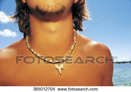 Picture - Mid section view of a man at the sea coast, Islamorada, Florida Keys, Monroe County, Florida, USA. Fotosearch