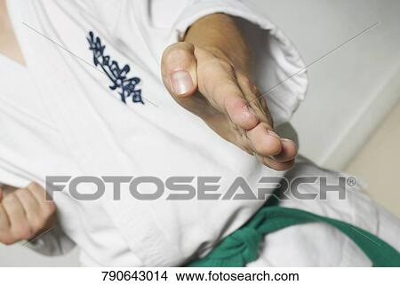 Mid section view of a man practicing karate View Large Photo Image Picture - Mid section view of a man practicing karate. Fotosearch